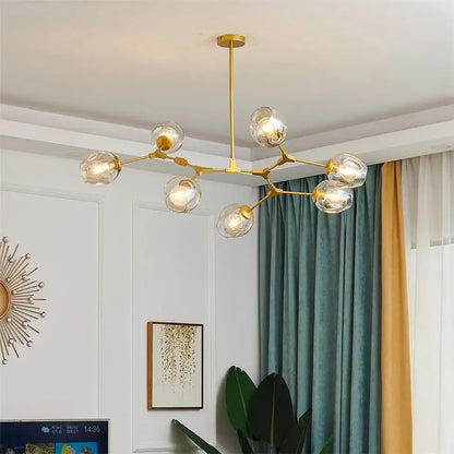 Gold-toned DecorBites™ modern nordic glass ball led chandelier with clear glass globe bulbs and branching metal frame