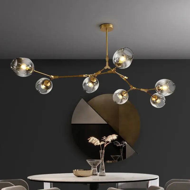 Gold-toned DecorBites modern nordic glass ball led chandelier with clear glass globe shades for elegant lighting