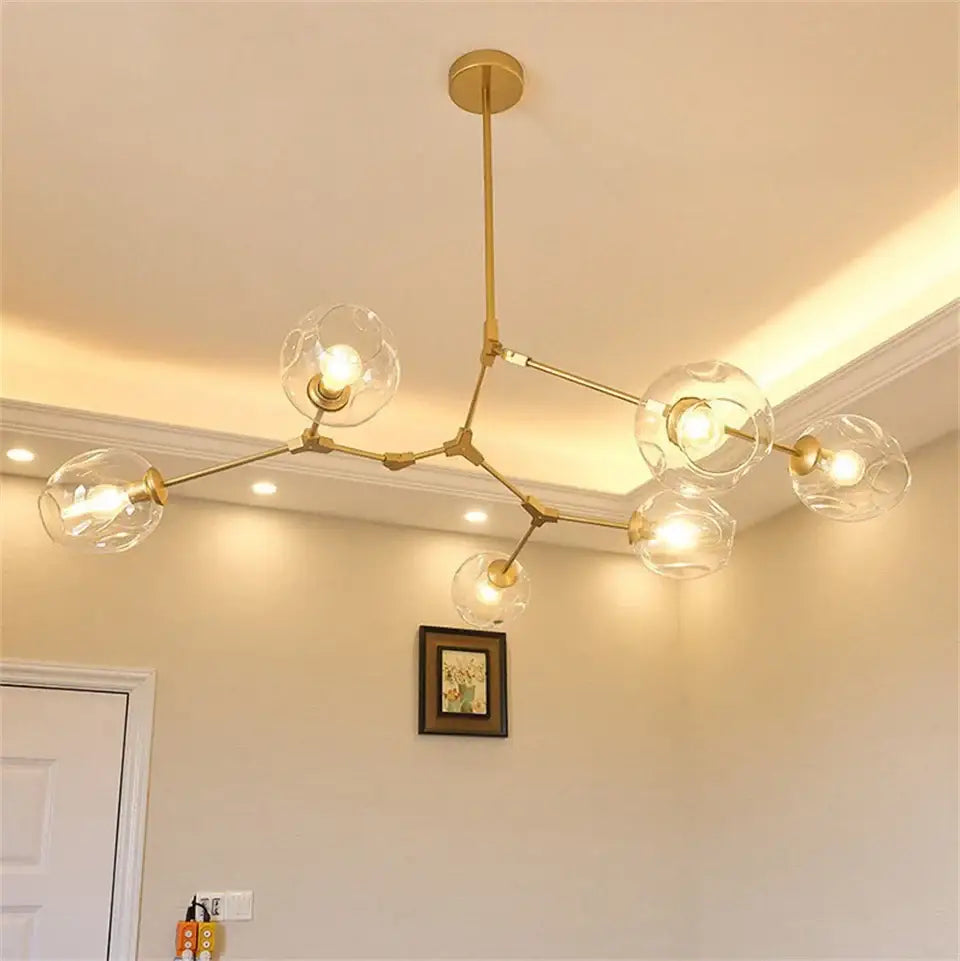 Gold-toned modern nordic glass chandeliers featuring clear globe bulbs in DecorBites™ LED pendant lamps design