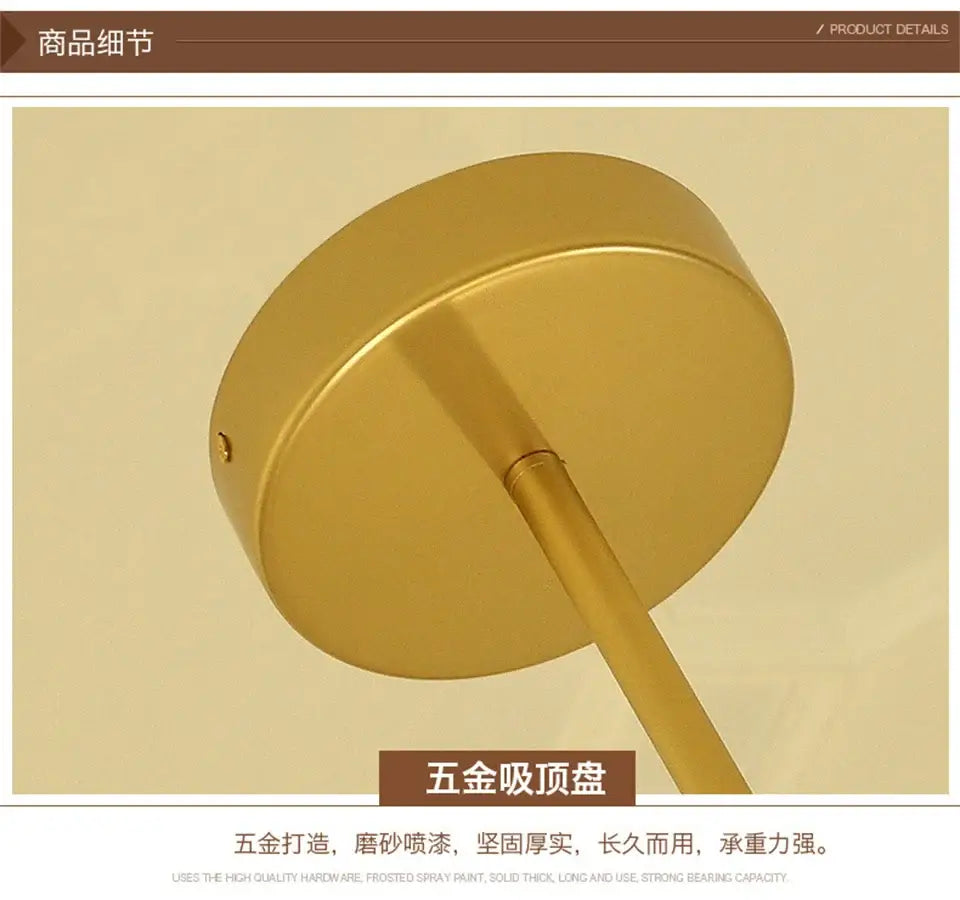 Gold-colored circular ceiling mount with sleek metallic finish and cylindrical stem for nordic lustre glass chandelier