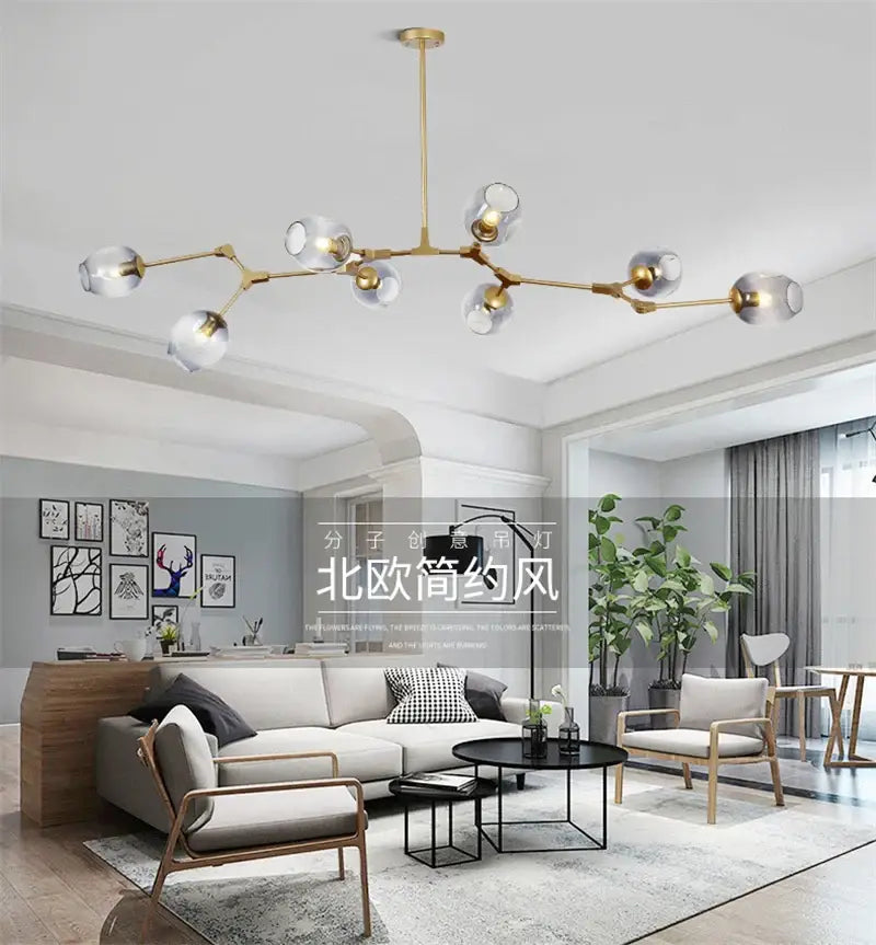 Gold-toned decorbites™ modern nordic glass chandelier with clear glass globe shades and integrated led lighting