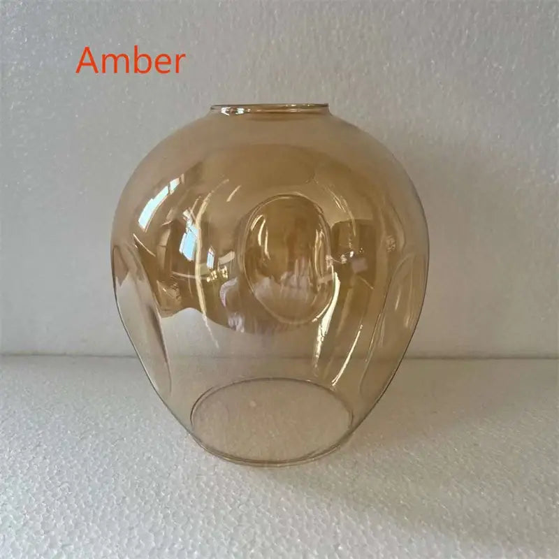 Amber-colored glass chandlier lampshade with smooth dome shape and subtle ridges in decorbites™ nordic lustre glass led lighting