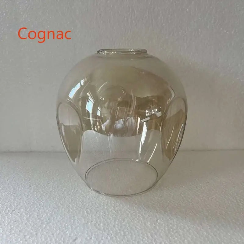 A translucent cognac-colored glass lampshade with embossed patterns for modern nordic glass chandeliers by decorbites