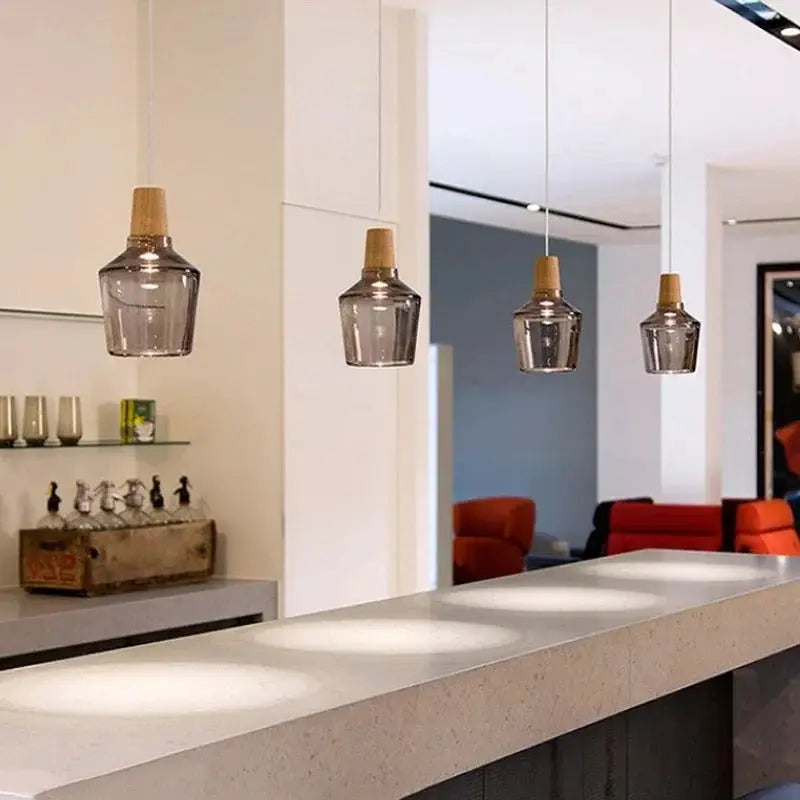 Decorbites™ modern nordic glass light fixtures featuring four smoked glass light fixtures with wooden tops above countertop