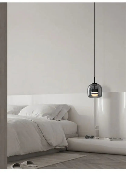Decorbites modern nordic glass pendant lamp with dark glass globe and black cord pendant lamp above bed