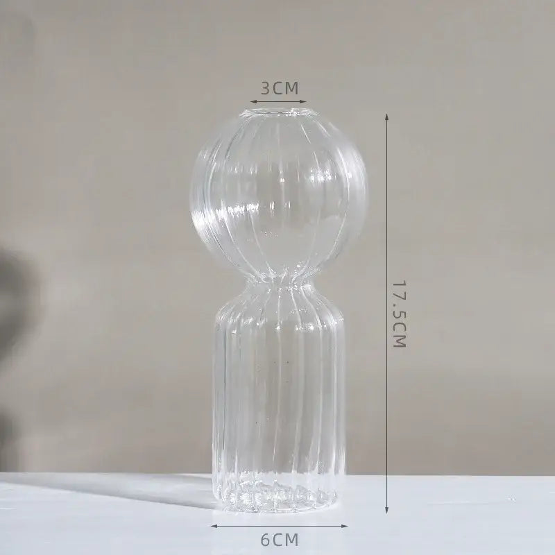 Clear glass DecorBites™ vase with ribbed bulbous upper section and slender base to decorate root for home or wedding