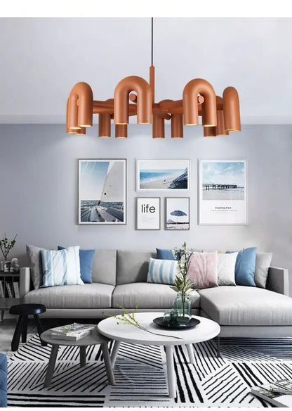 Decorbites modern nordic copper-toned led ceiling chandelier with curved pipe-like arms and central hanging rod