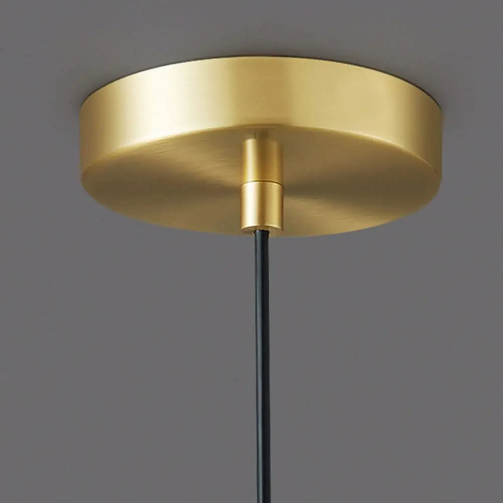 Gold-finished circular DecorBites modern nordic pendant light with sleek design and black cord for stylish lighting