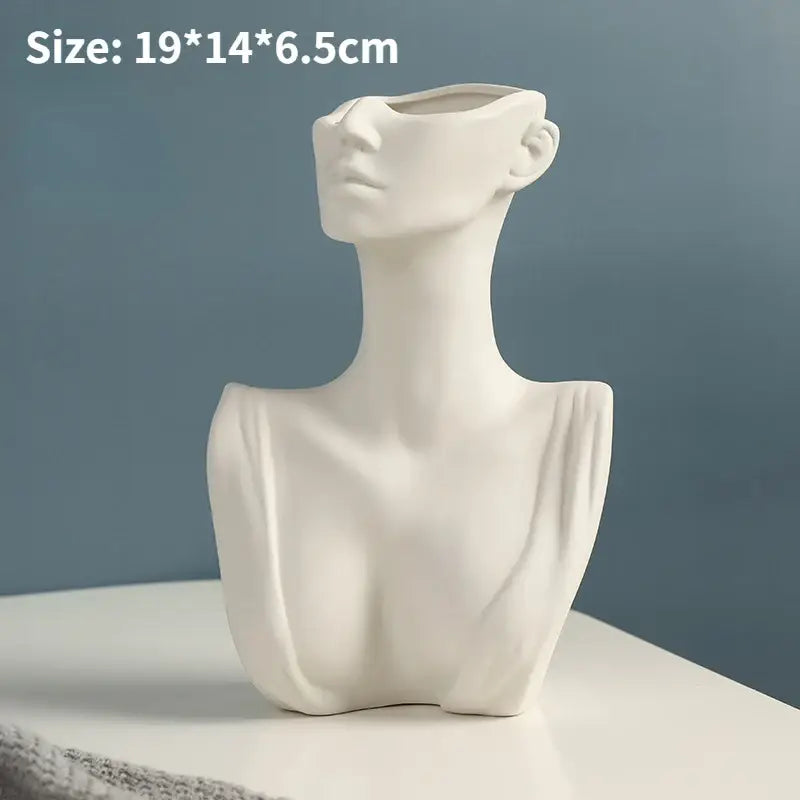 White ceramic nordic style ceramic vase shaped like a woman’s bust with open face and neck from DecorBites™