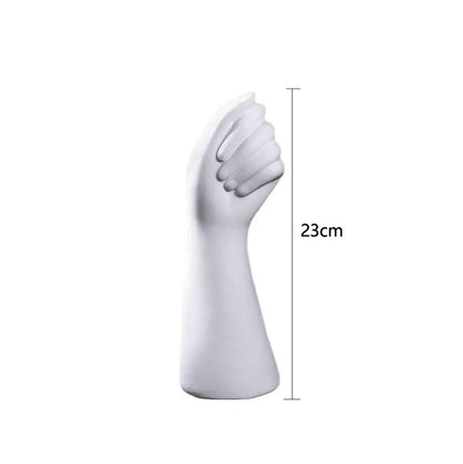 White ceramic sculpture of a clenched fist hand vase 23cm tall in modern nordic style by decorbites