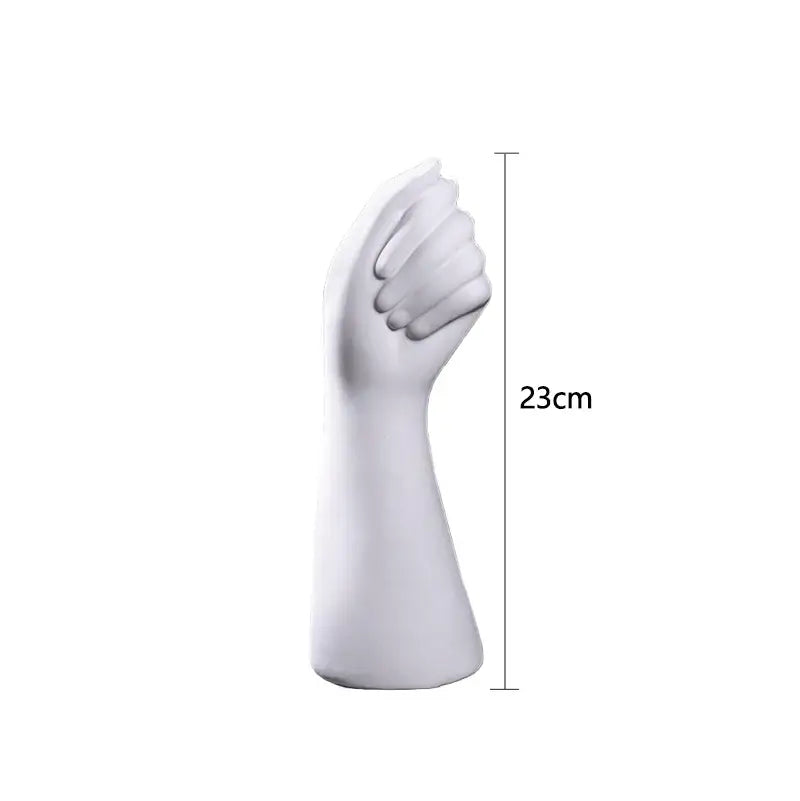 White ceramic sculpture of a clenched fist hand vase 23cm tall in modern nordic style by decorbites