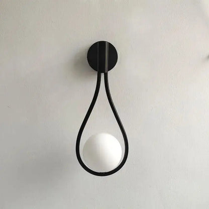 DecorBites™ modern Nordic black wall lamp featuring a minimalist teardrop frame with a frosted spherical bulb