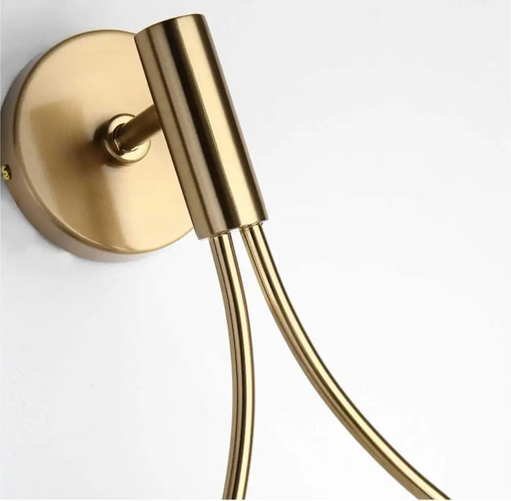 Gold-toned wall-mounted towel rack with sleek cylindrical design and polished metal finish for livi wall lamp decorbites modern nordic wall lamp