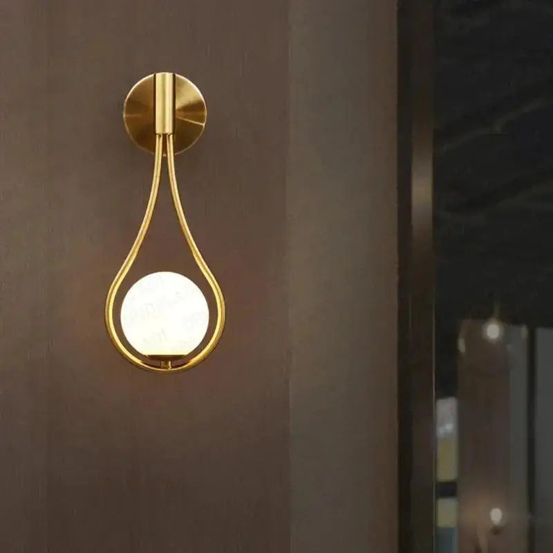 Gold-toned teardrop-shaped decorbites modern nordic wall lamp with frosted glass globe for livi wall lamp use