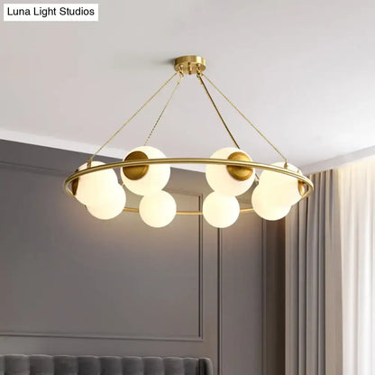 DecorBites modern opal glass ball chandelier with gold-toned circular frame and frosted glass spheres lighting fixture