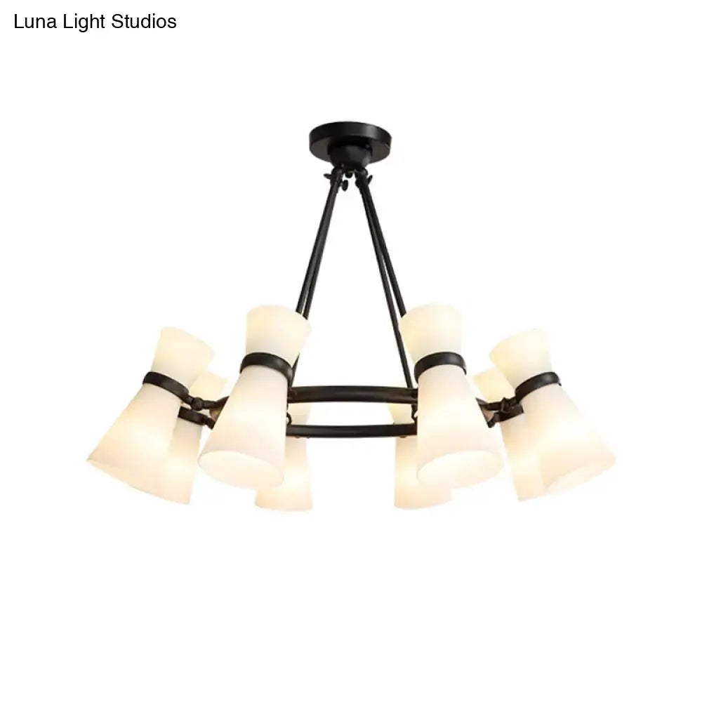 Black metal chandelier with eight frosted glass shades in wide flare pendant design for flare pendant lighting