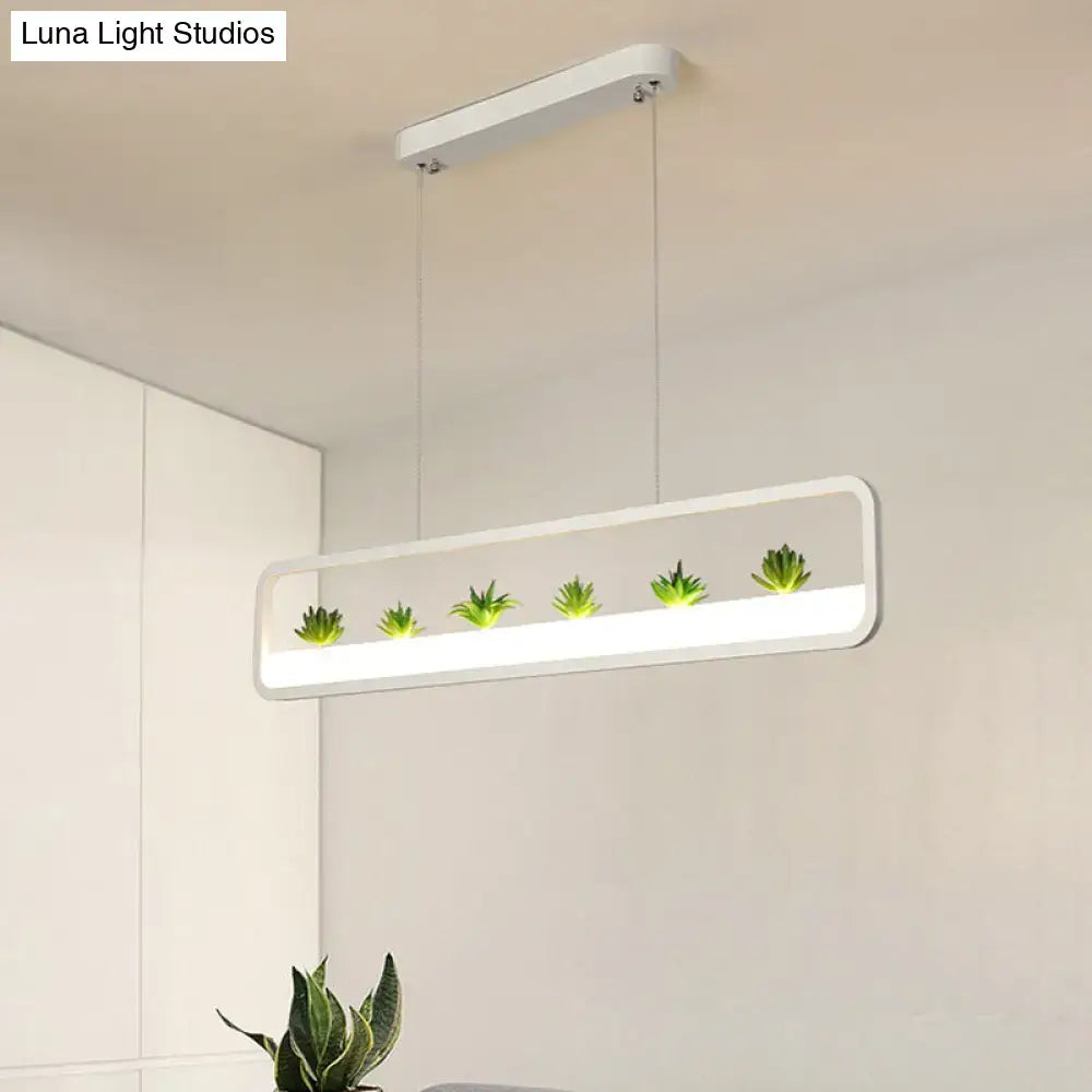 White rectangular acrylic pendant ceiling light with integrated led and five green succulents for dining room ceiling