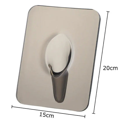 A sleek stainless steel wall hook with rounded edges complements the modern transparent square vase decorbites for flowers