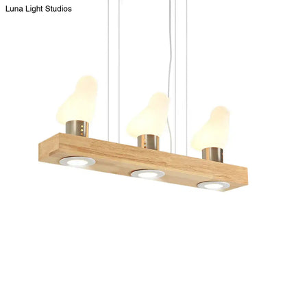 Decorbites modern wooden island light with bird-shaped warm glass shades and brass fixtures for dining room use