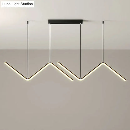 Modern black metal hanging lamp with three angular led arms emitting warm white light for dining room lighting