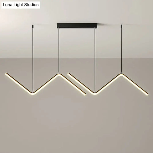 Modern black metal hanging lamp with three angular led arms emitting warm white light for dining room lighting
