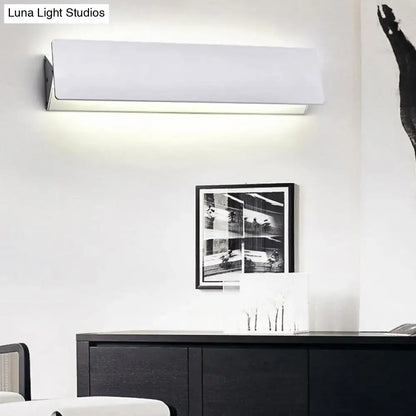 Modern white rectangular wall light offers sleek minimalist design with direct wired electric installation for outdoor use