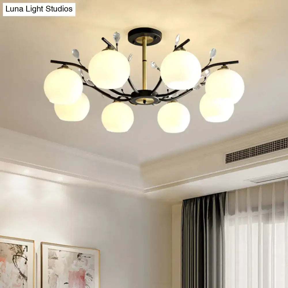 Decorbites modernist semi flush mount ceiling light with black and brass branch design and cream clear glass globes