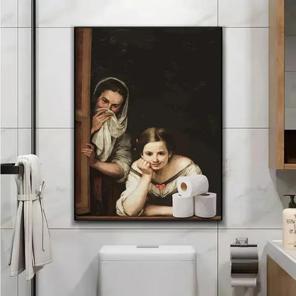 A framed canvas print of mona lisa bathroom wall art featuring two figures with white bathroom toilet paper rolls below