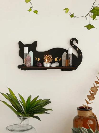 DecorBites™ moon phase black cat wooden shelf with sun and moon cutouts holding crystals and small bottles