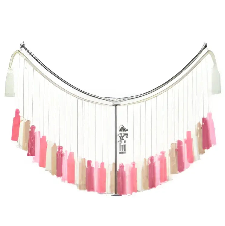 A delicate moroccan bohemian wall decor tapestry featuring a curved fringe scarf with cascading tassels in soft pink and beige