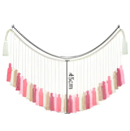 A delicate moroccan bohemian wall decor tapestry featuring a curved fringe scarf with cascading tassels in soft pink and beige