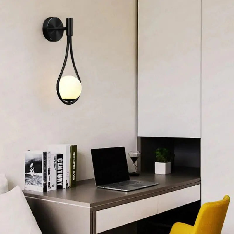 Black metal wall lamp DecorBites Moroccan gold modern nordic wall lamp with teardrop frame and glowing white spherical bulb