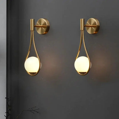 Decorbites™ moroccan gold modern nordic wall lamp with gold-toned metal frame and warm-glowing spherical glass shades
