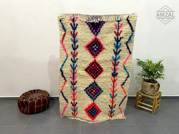Beige moroccan handmade azilal rug with bold pink blue and purple geometric diamond patterns vertical lines 1.5m x 1m
