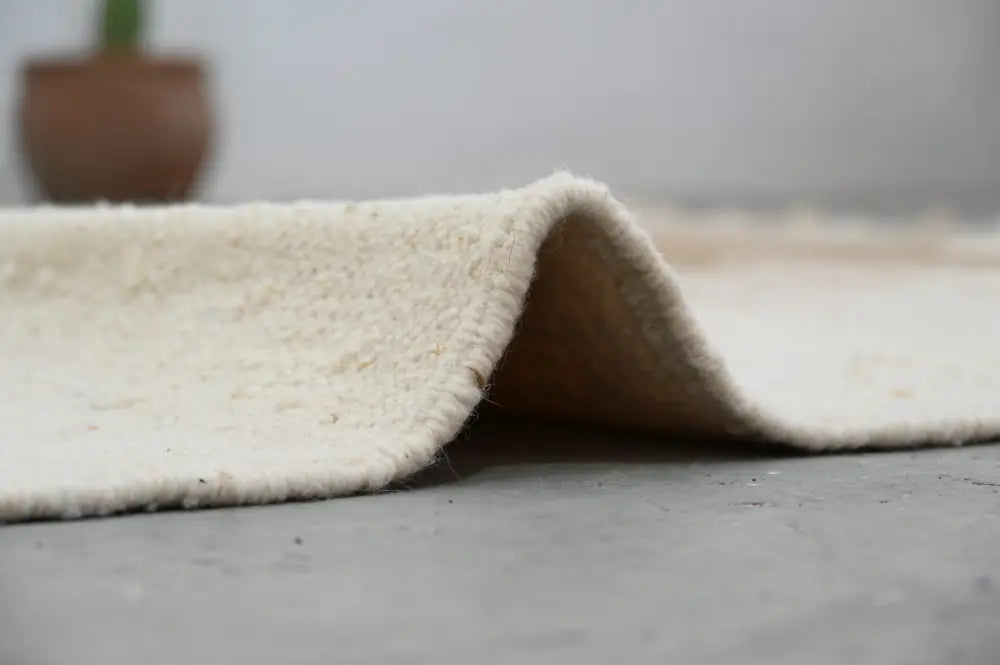 Decorbites moroccan handmade azilal rug cream-colored plush wool with soft textured surface and frayed edges 300x200cm