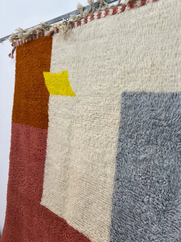 Decorbites moroccan handmade beni ouarain rug with plush cream base and bold rust orange, terracotta, slate gray, and yellow blocks