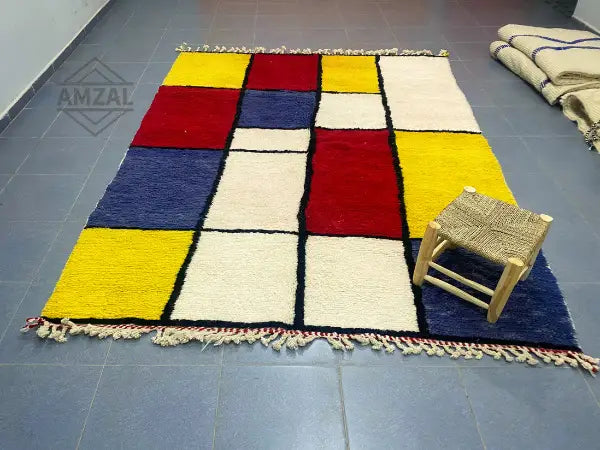 Decorbites moroccan handmade beni ouarain rug with vibrant geometric wool squares in red yellow blue and cream colors