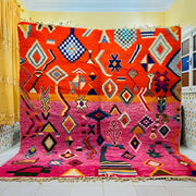 Vibrant orange and pink moroccan handmade beni ouarain rug with intricate blue white and black geometric patterns 3m x 2.5m