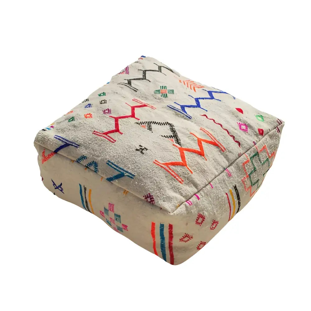 Beige moroccan handmade beniourain pouf with colorful geometric embroidery made from natural wool by DecorBites