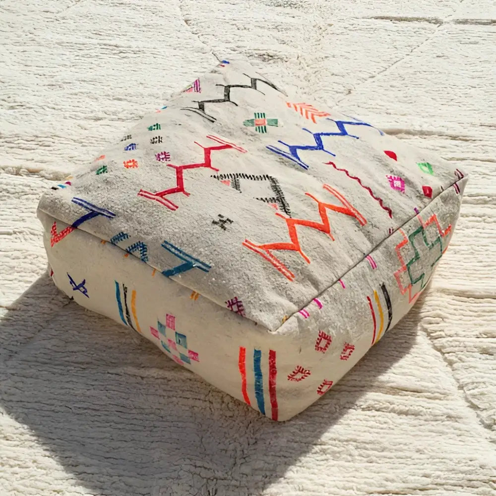 Beige DecorBites™ moroccan handmade beniourain pouf with colorful geometric embroidery in natural wool