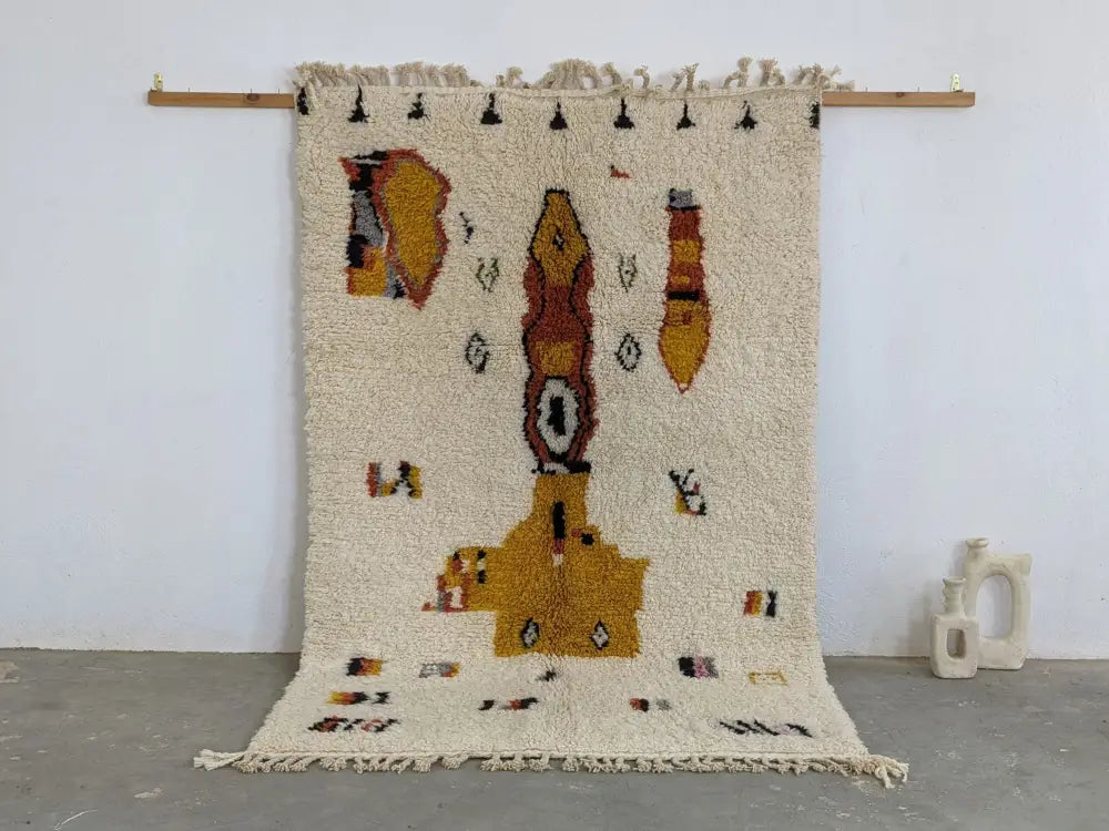Cream-colored textured wool moroccan handmade traditional azilal carpet with mustard yellow and terracotta geometric patterns