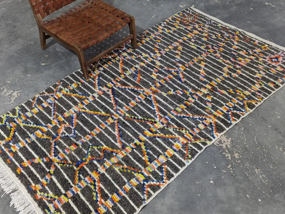 Decorbites™ moroccan handmade azilal rug in dark gray with vibrant geometric patterns woven from pure natural wool