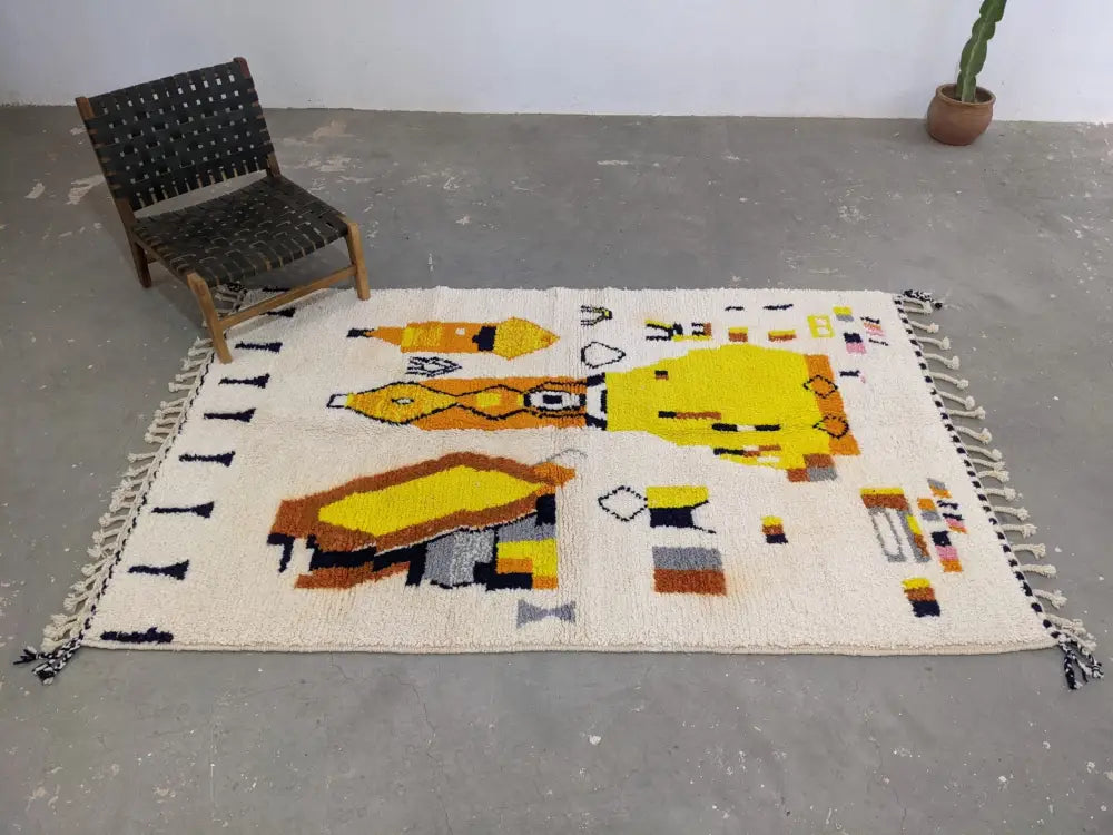 Cream-colored moroccan handmade traditional azilal rug with yellow orange abstract shapes and white fringe 250 x 162 cm