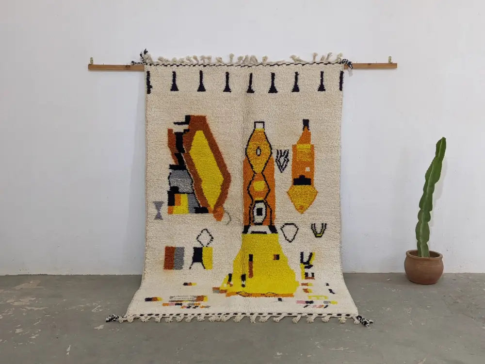 Cream-colored moroccan handmade traditional azilal rug with bold geometric patterns and fringe 250 x 162 cm