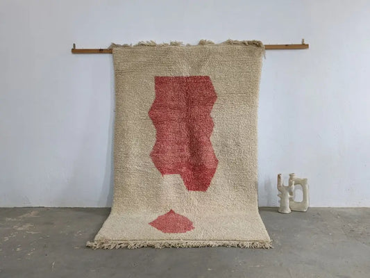 Beige woven moroccan handmade traditional azilal rug with bold red abstract leaf design and fringed edges 255 x 155 cm