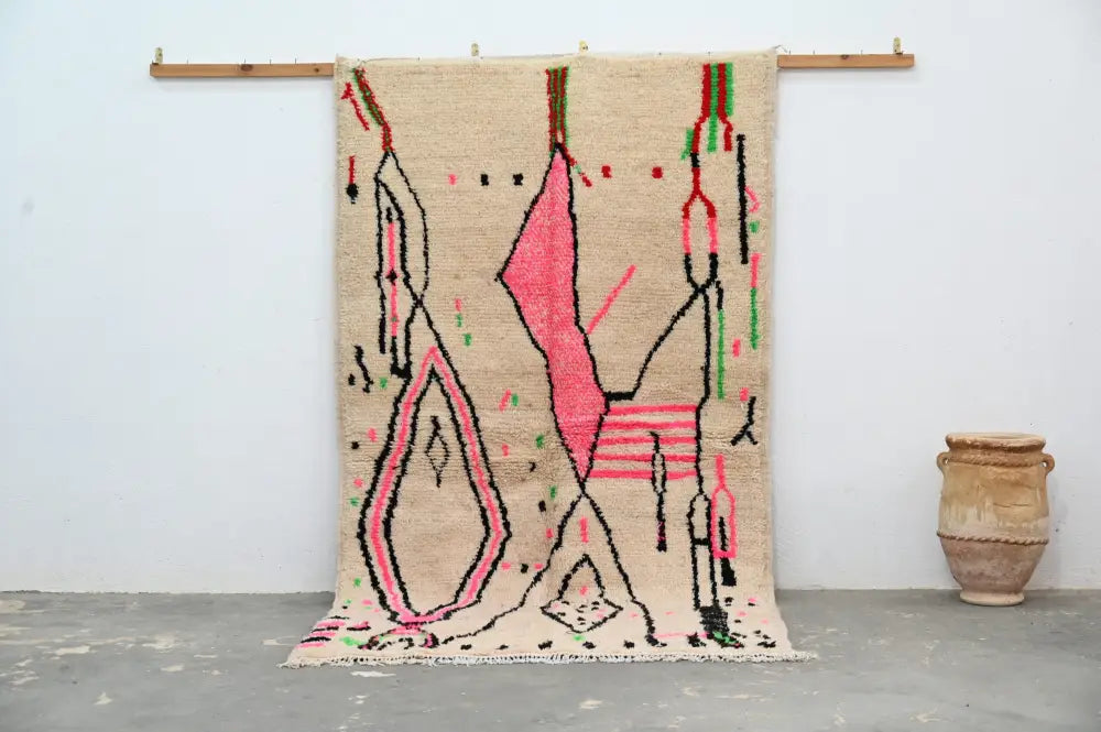 Beige moroccan handmade traditional azilal rug with bold pink black and green geometric patterns 256 x 136 cm