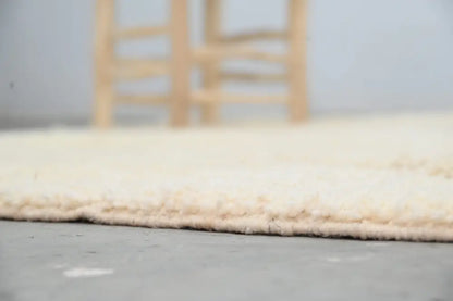 Cream-colored plush shaggy decorbites moroccan handmade traditional azilal rug with soft textured surface 256 x 157 cm