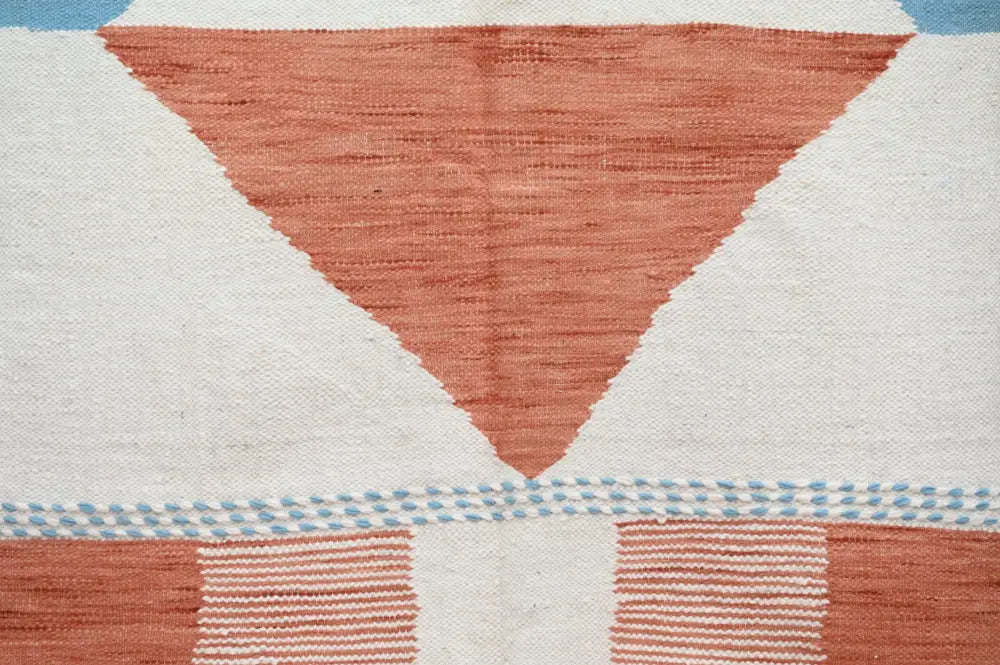 DecorBites™ moroccan handmade traditional azilal rug featuring geometric terracotta triangles and light blue accents