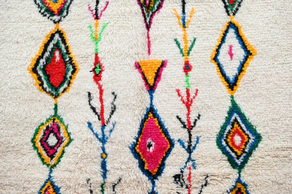 DecorBites™ moroccan handmade traditional azilal rug with vibrant geometric patterns on plush white wool base 262 x 157 cm