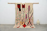 Beige decorbites™ moroccan handmade traditional azilal rug with abstract red black pink green and yellow geometric patterns